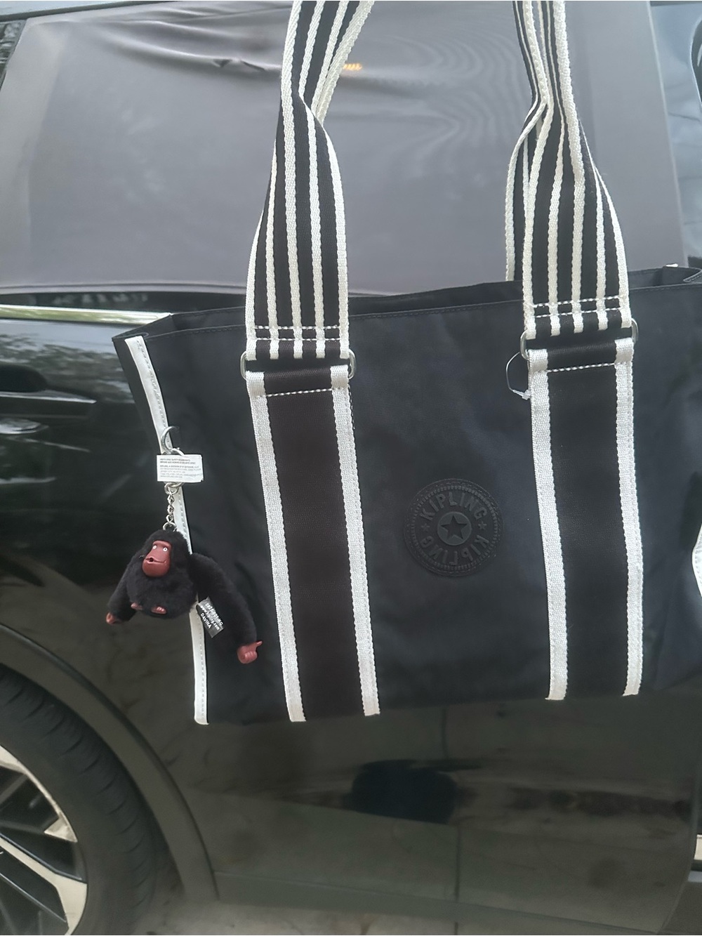 Kipling Black Canvas Tote with White-Trim Striped Handles